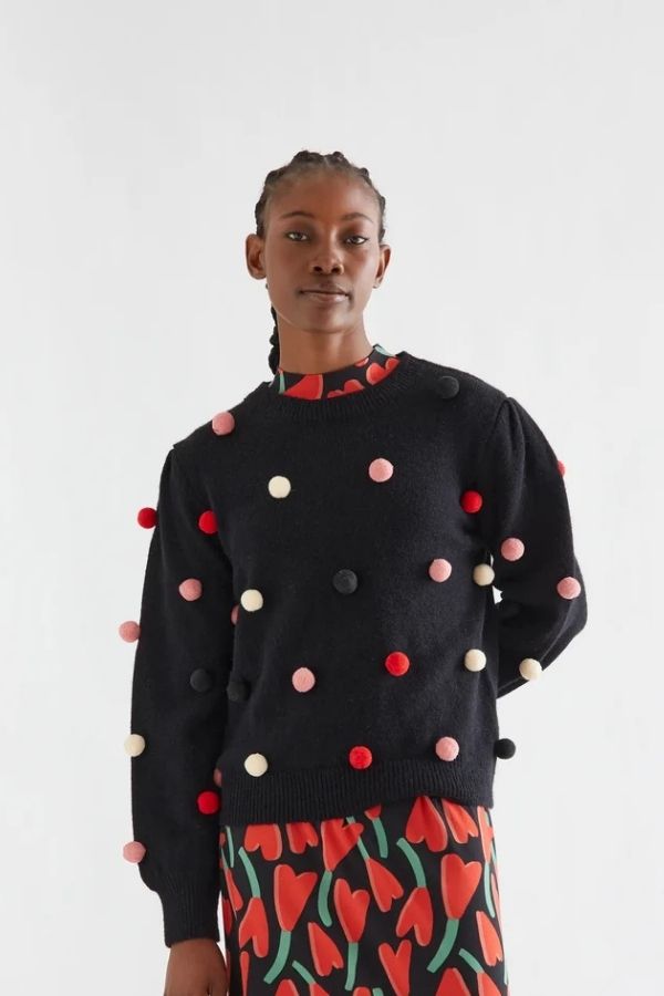 Black knit sweater with multicolored pompoms | Compania Fantastica
